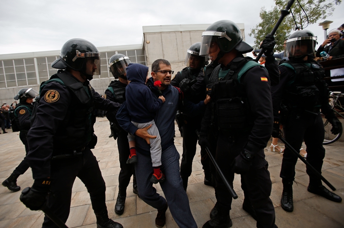 Spain riot police smash way into Catalan voting center | News