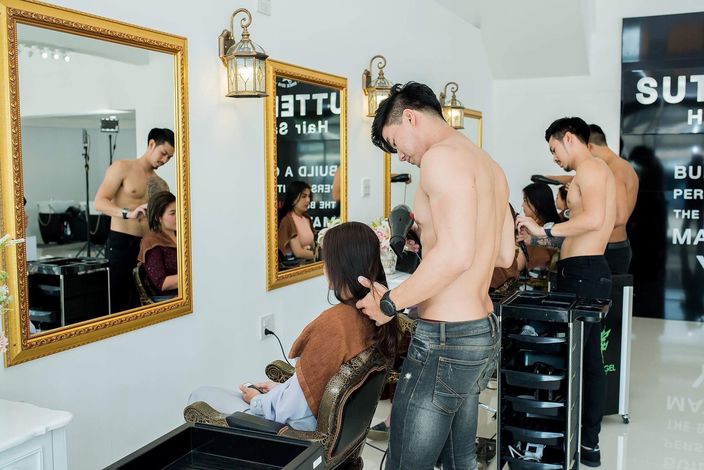 Salon in Thailand employs young muscular barbers to serve customers half-na...