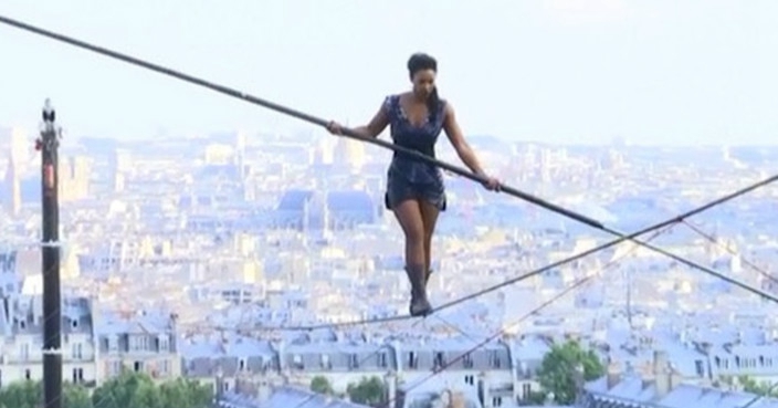 Tightrope walker performs above Paris city with no security