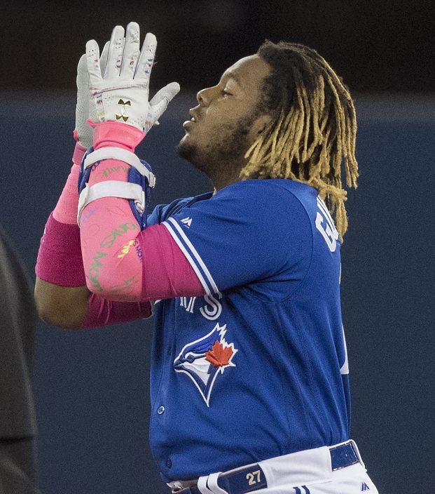 Adlin Auffant, mother of Toronto Blue Jays pitcher Marcus Stroman, throws  out the ceremonial first pitch prior to a baseball game against the Chicago  White Sox in Toronto, Sunday, May 12, 2019. (