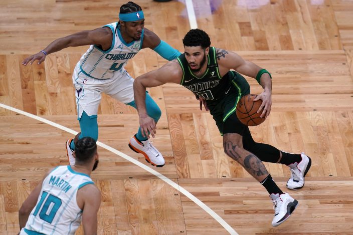 Ball's triple-double carries Hornets past Celtics, 111-102