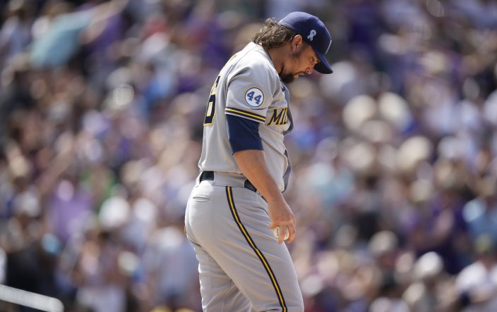 Images from the Brewers' 11-7 loss to the Rockies
