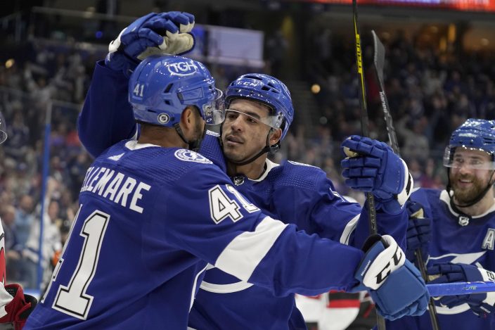 Tampa Bay Lightning defenseman Victor Hedman (77, right) celebrates with  teammates, including right wing Taylor Raddysh (16) and left wing Ross  Colton (79) after scoring against the New Jersey Devils during the