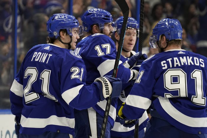 Tampa Bay Lightning defenseman Victor Hedman (77, right) celebrates with  teammates, including right wing Taylor Raddysh (16) and left wing Ross  Colton (79) after scoring against the New Jersey Devils during the