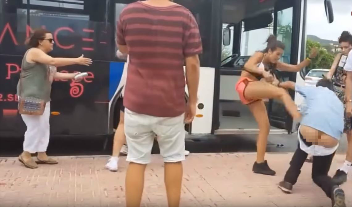 Girl in hot pants pulls down a bus driver’s underwear in scuffle.